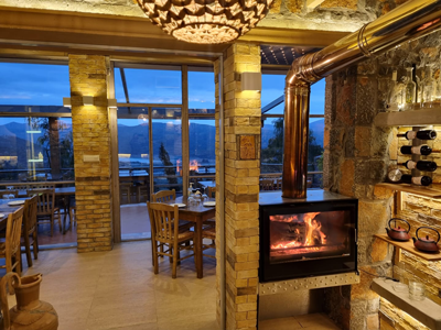 cozy fire place, also open in the winter months - in Velani hotel